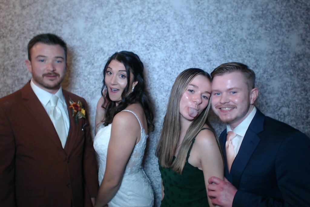 Wedding couple with guests in the photo booth