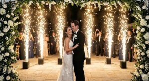 Bride and groom first dance with cold spark fountains