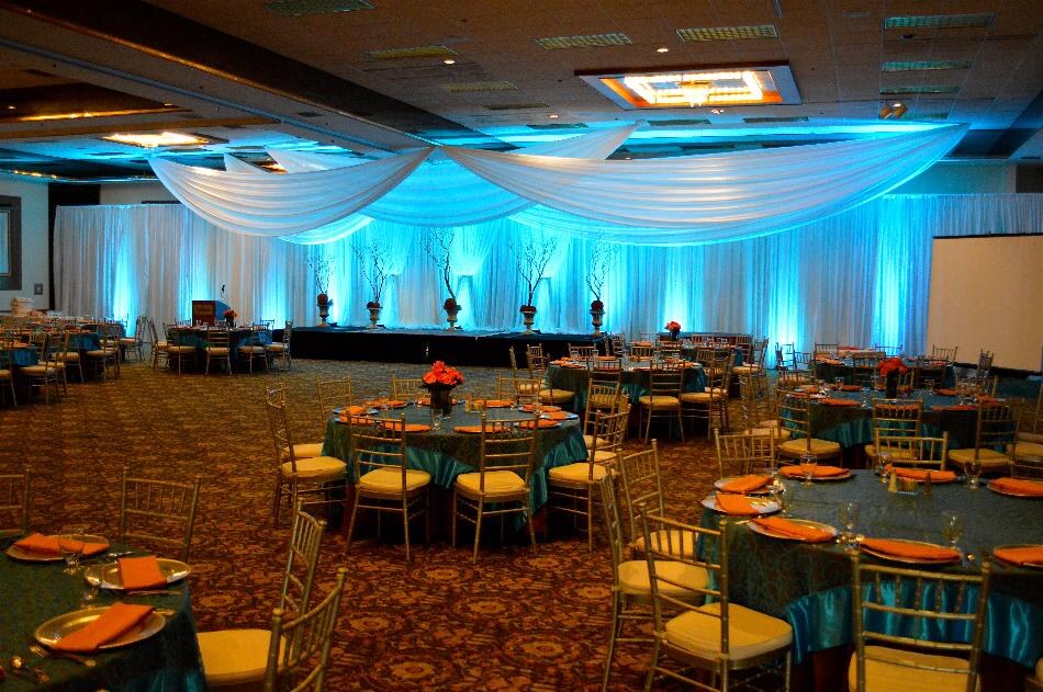 Blue uplighting in a wedding reception hall